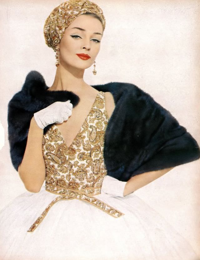 #12 Dolores Hawkins in a hand-embroidered golden paisley challis bodice and white organdy skirt with matching turban by James Galanos, Harper’s Bazaar, March 1958.