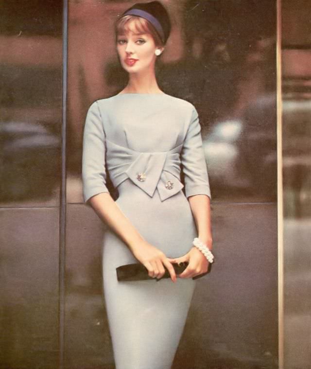 #14 Dolores Hawkins wearing an empire draped wool dress by R & K Originals, 1958.