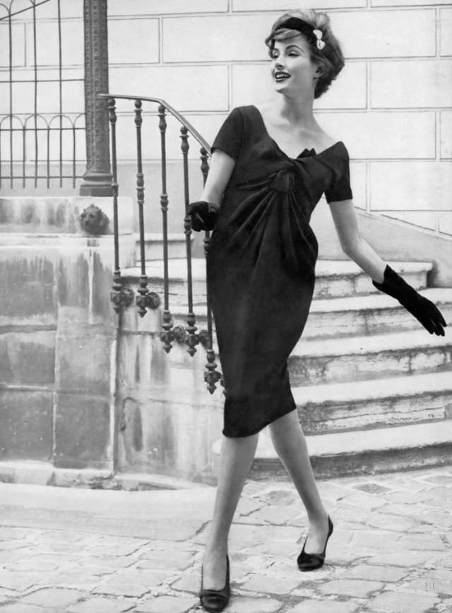 #6 Gitta Schilling in black crêpe dress by Guy Laroche, October 1, 1958.