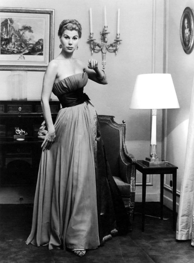 #10 Stella in a pale blue mousseline evening gown by Jacques Fath, 1953.