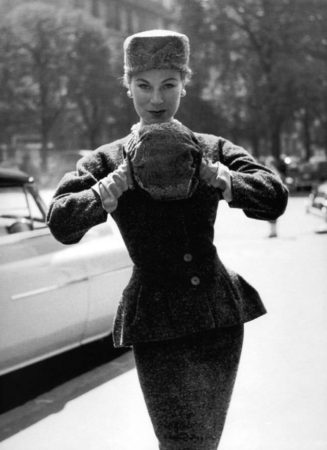 #11 Stella in a peplum jacket and skirt by Jacques Fath, Paris, 1953.
