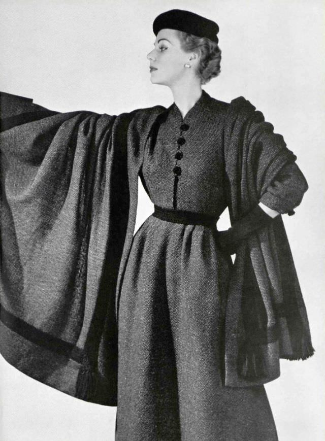 #14 Stella in a tweed day-dress with shawl by Madeleine de Rauch, 1953.