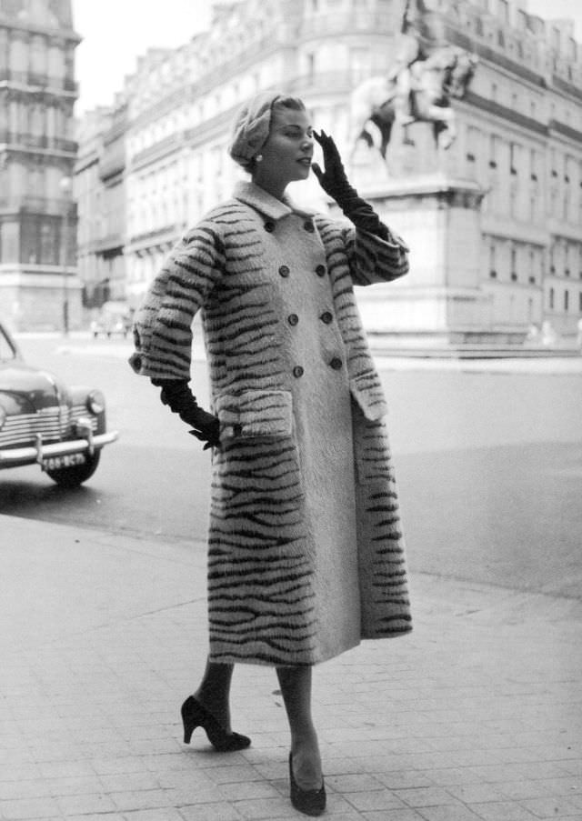 #16 Stella in a tiger-stripe wool coat by Jacques Fath, Paris, 1953.