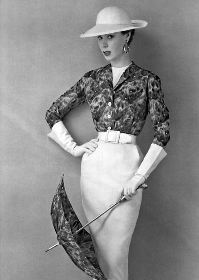 #17 Stella in a white linen dress with a printed bolero by Givenchy, 1953.
