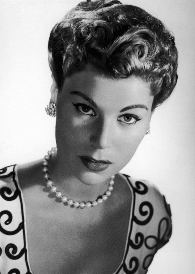 #23 Stella in hair and make-up by Elizabeth Arden for Jacques Fath, 1954.
