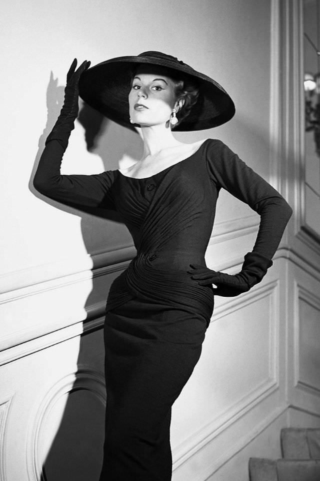 #24 Stella in a sheath dress by Christian Dior, 1954.