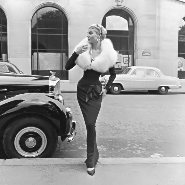 #2 Stella in a slim-fitting evening dress with white fox fur collar by Jacques Fath, 1951.