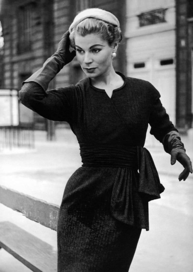 #29 Stella in a slim wool dress by Jacques Fath, Paris, 1955.