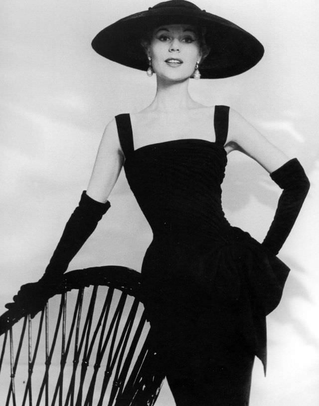 #31 Stella in a silk-crèpe cocktail dress by Jacques Fath, 1955.
