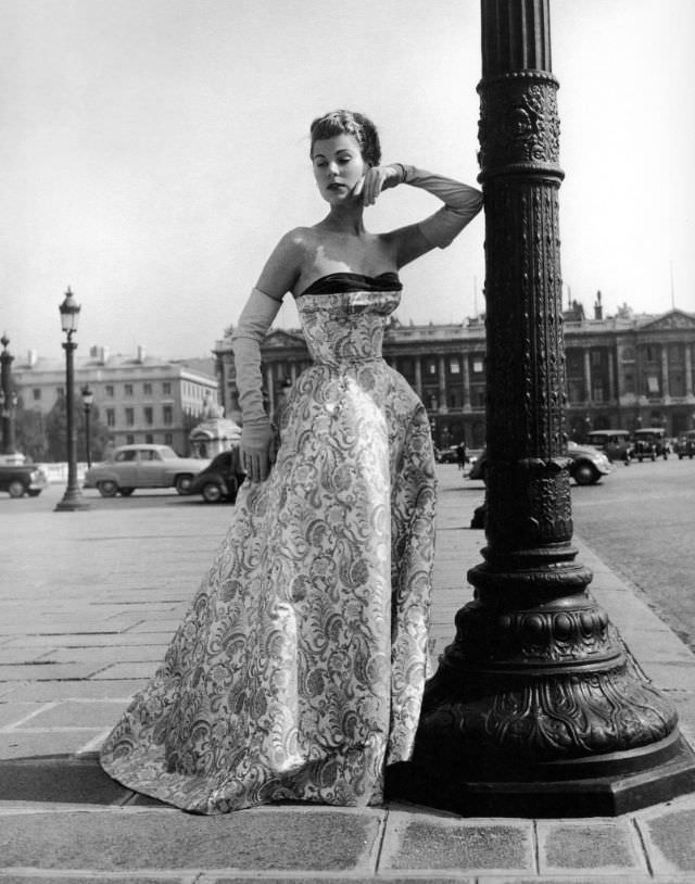 #5 Stella in a satin strapless evening gown by Jacques Fath, Paris, 1953.