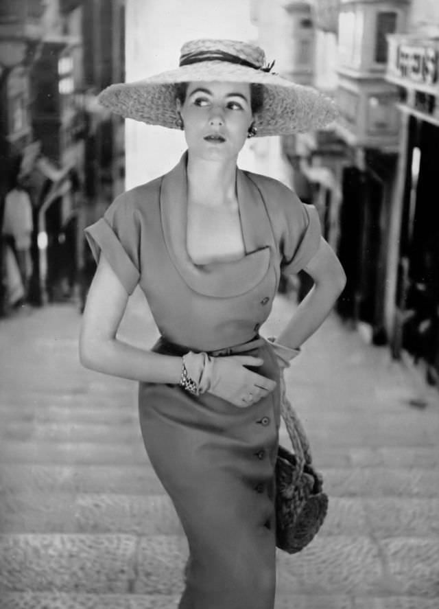 #22 Pat O’Reilly in a tangerine shantung dress by Dorville, Malta, Harper’s Bazaar UK, May 1951.
