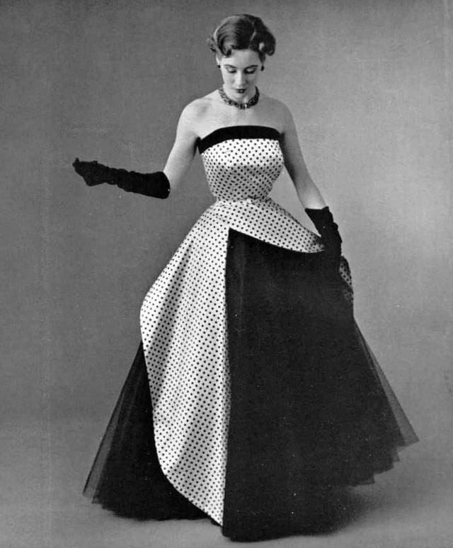 #25 Pat O’Reilly in a white satin and navy tulle dress by Jean Patou, 1952.