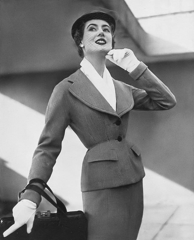 #27 Pat O’Reilly in a gray-and-white birdseye suit by Lachasse, Harper’s Bazaar UK, March 1952.