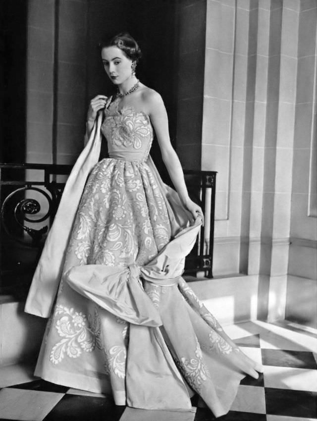 #28 Pat O’Reilly in a lace evening gown by Germaine Lecomte, 1952.