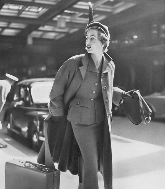 #31 Pat O’Reilly in a sea-green hopsack topcoat by Hardy Amies, Harper’s Bazaar UK, September 1952.
