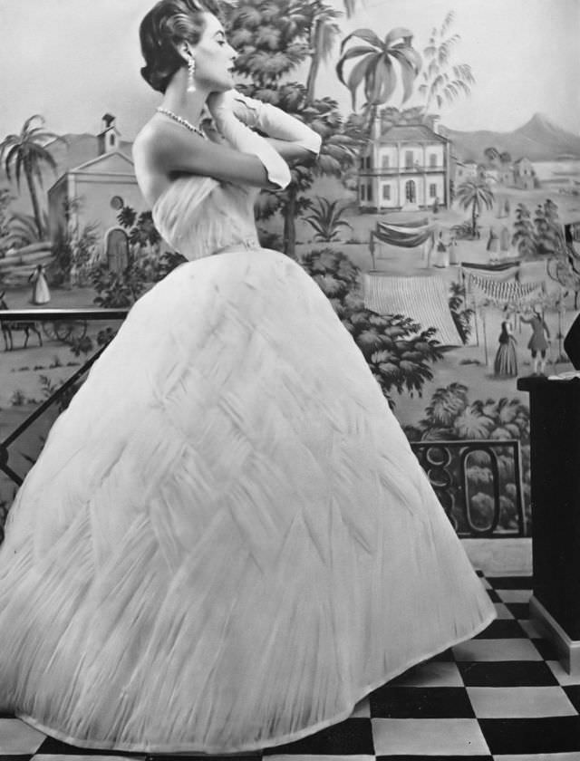 #33 Pat O’Reilly in a dawn-blue tulle gown by Pierre Balmain, Harper’s Bazaar UK, September 1953.
