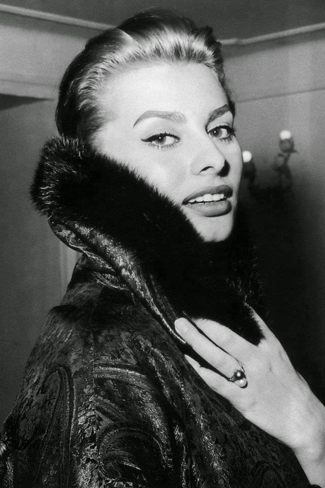 #17 Sophia Loren wearing a Christian Dior brocade coat, February 1956.