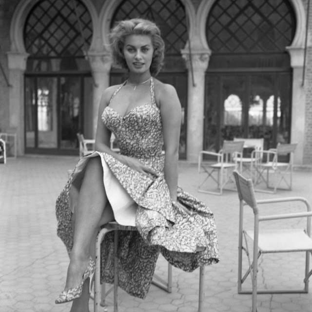 #7 Sophia Loren in a flower print halter dress in Venice, 1955.