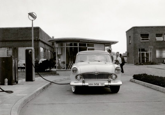 #18 Couple refueling a Simca Vedette, Hamburg, circa 1950s.