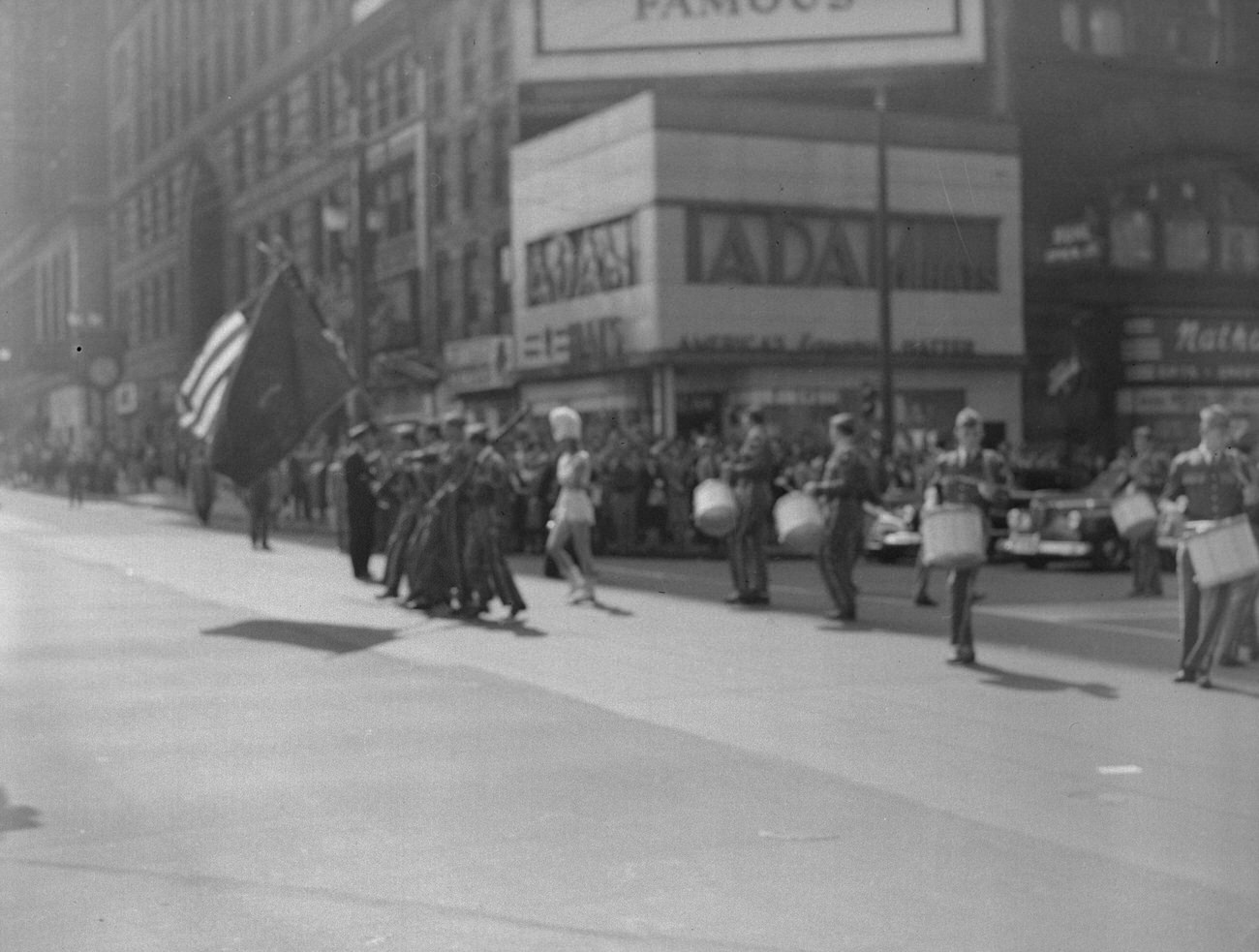 #8 AmVets Post No 8 band marching downtown, featuring Adam Hat Store and Nathan’s Gift Shop, 1948.