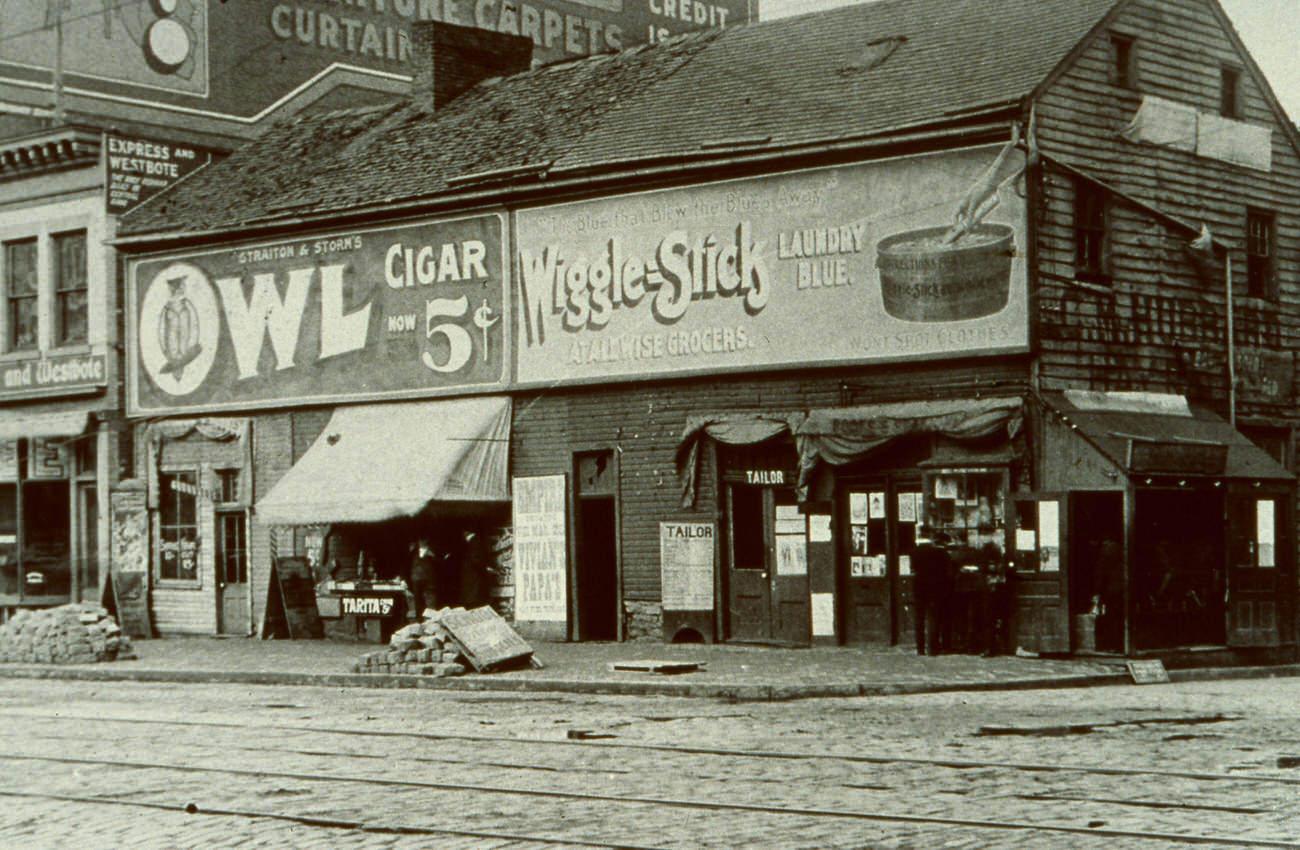 #20 C. M. Hubbard Livery on High and Cherry Streets, business location 1891-1896, photo showing Swan Tavern, later Franklin House, demolished October 27, 1912, Circa 1891