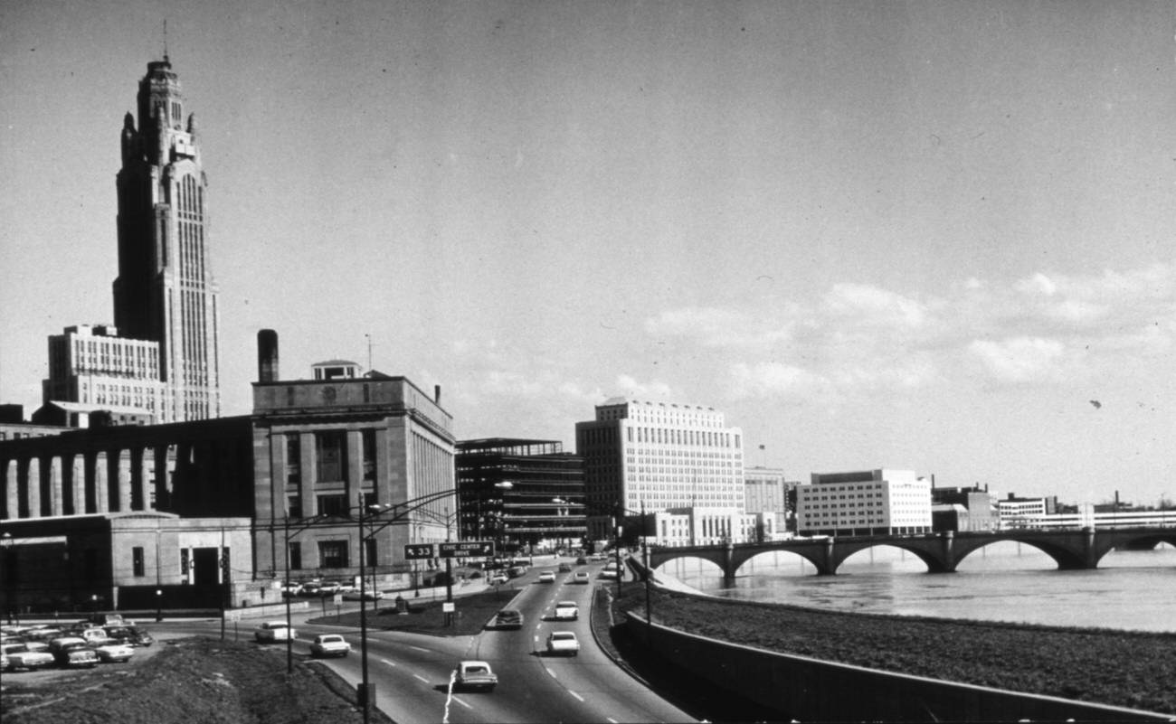 #10 Civic Center looking south from Lafayette Street, showing afternoon traffic and the Federal Building, 1964.