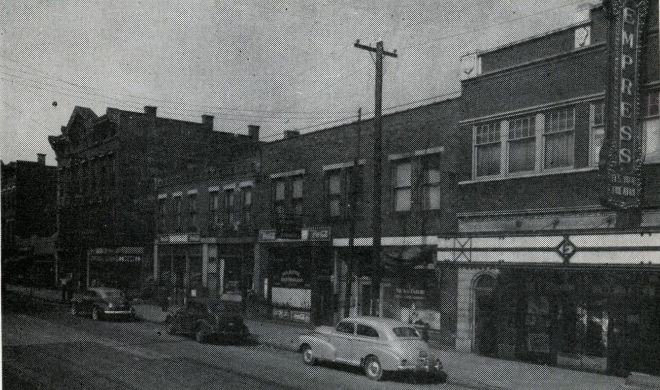#24 Bronzeville scenes at Long and Garfield, featuring Empress Theatre and other businesses, 1945.