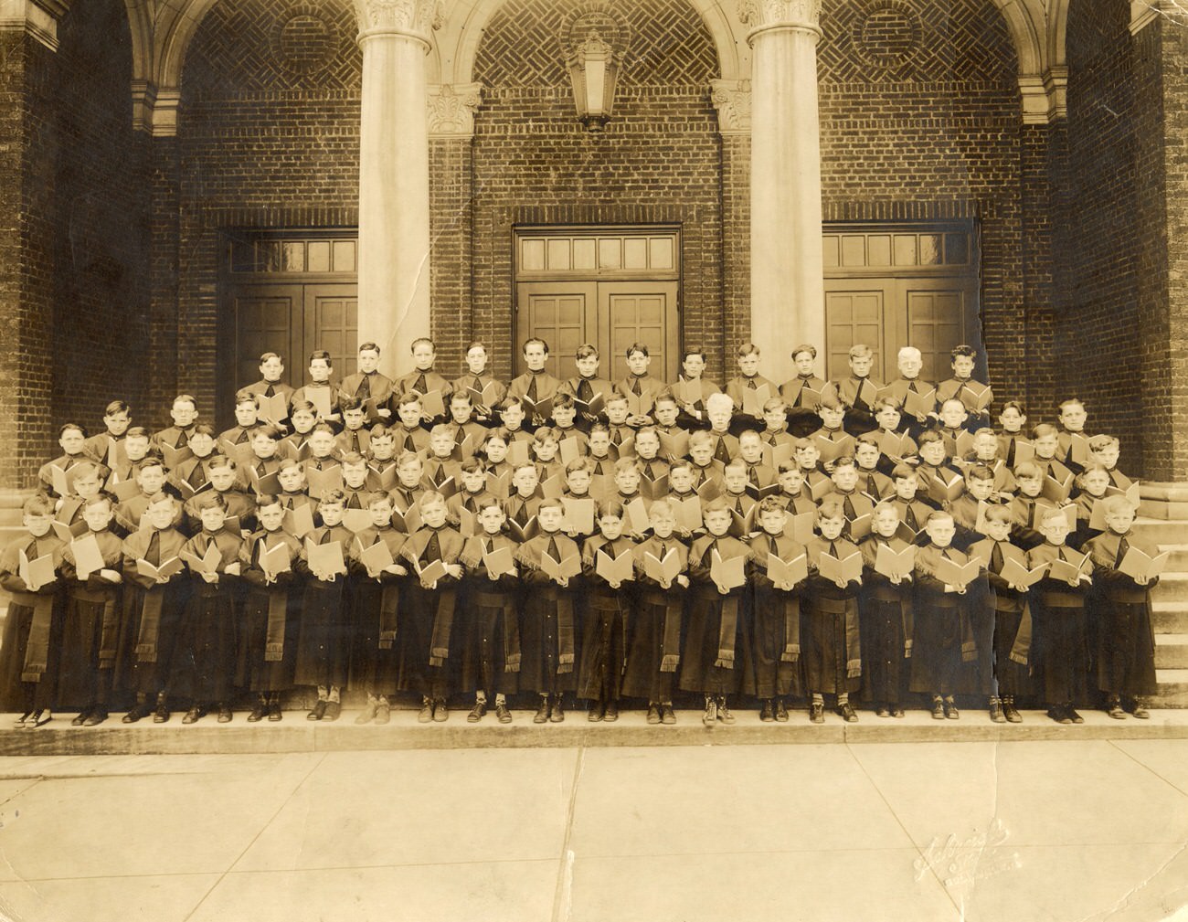 #22 Young boys in church garb on the front steps of Holy Rosary Church, Columbus, 1930s