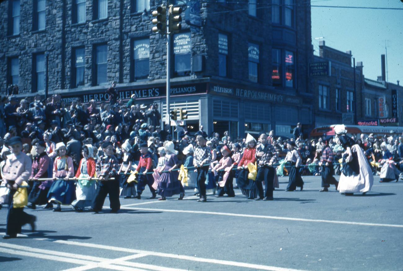 #51 Parade in Holland, Michigan, featuring children in Dutch costume, 1950s