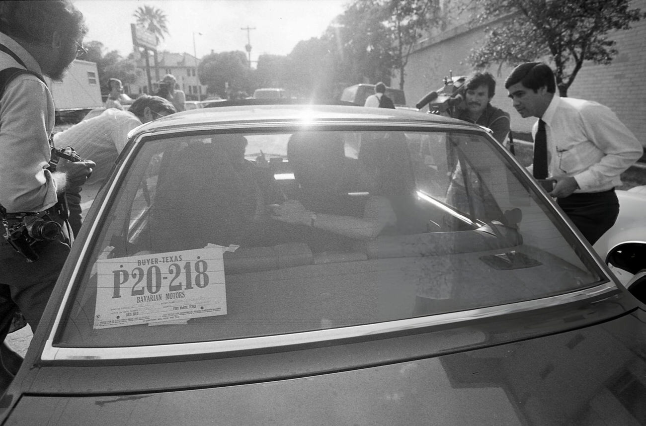 #39 Chinese ballet dancer Li Cunxin and Elizabeth Mackey’s car is surrounded by media after leaving the People’s Republic of China consulate in Houston, 1981.