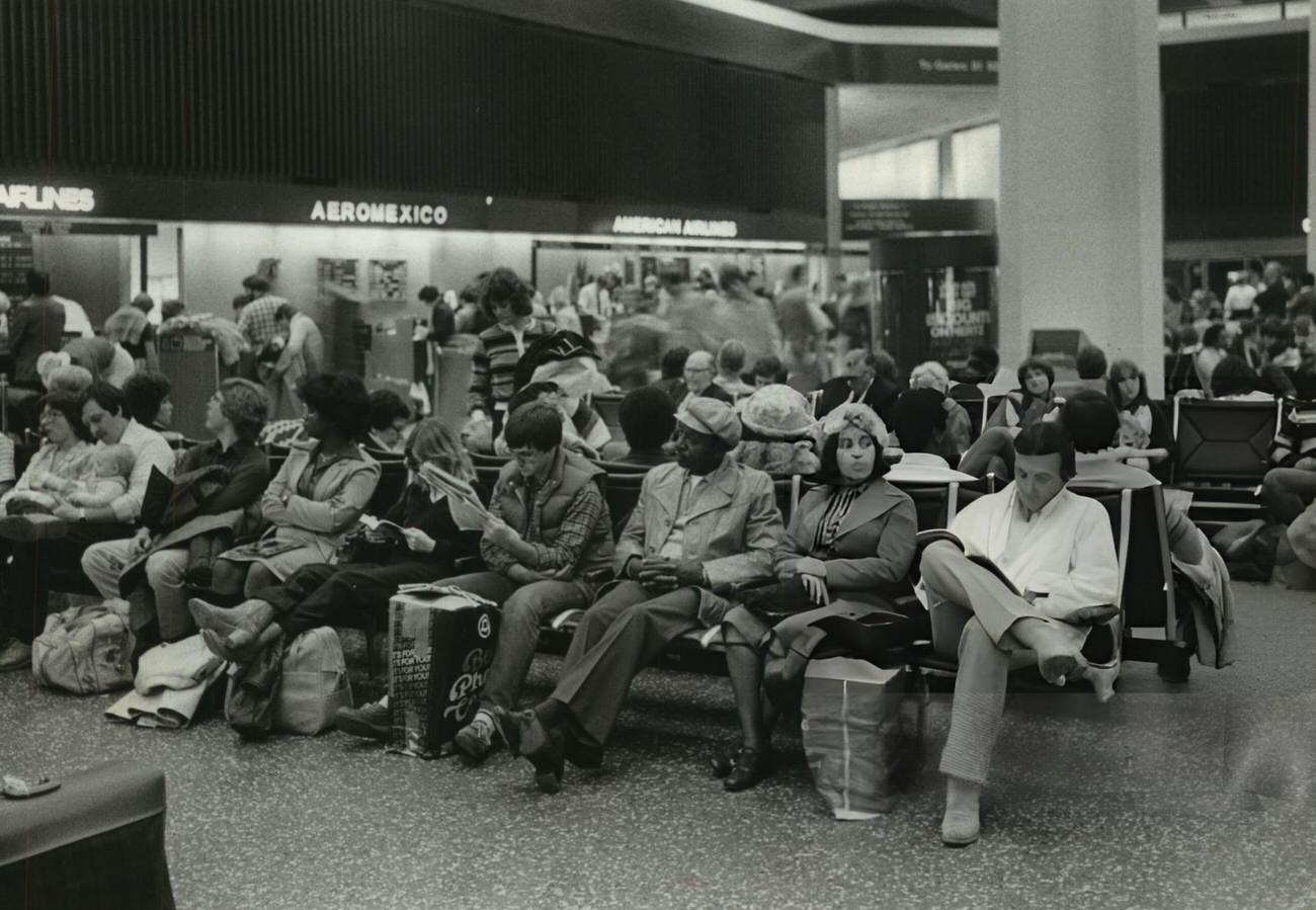 #4 Travelers wait for flights at Houston Intercontinental Airport, Houston, Texas.
