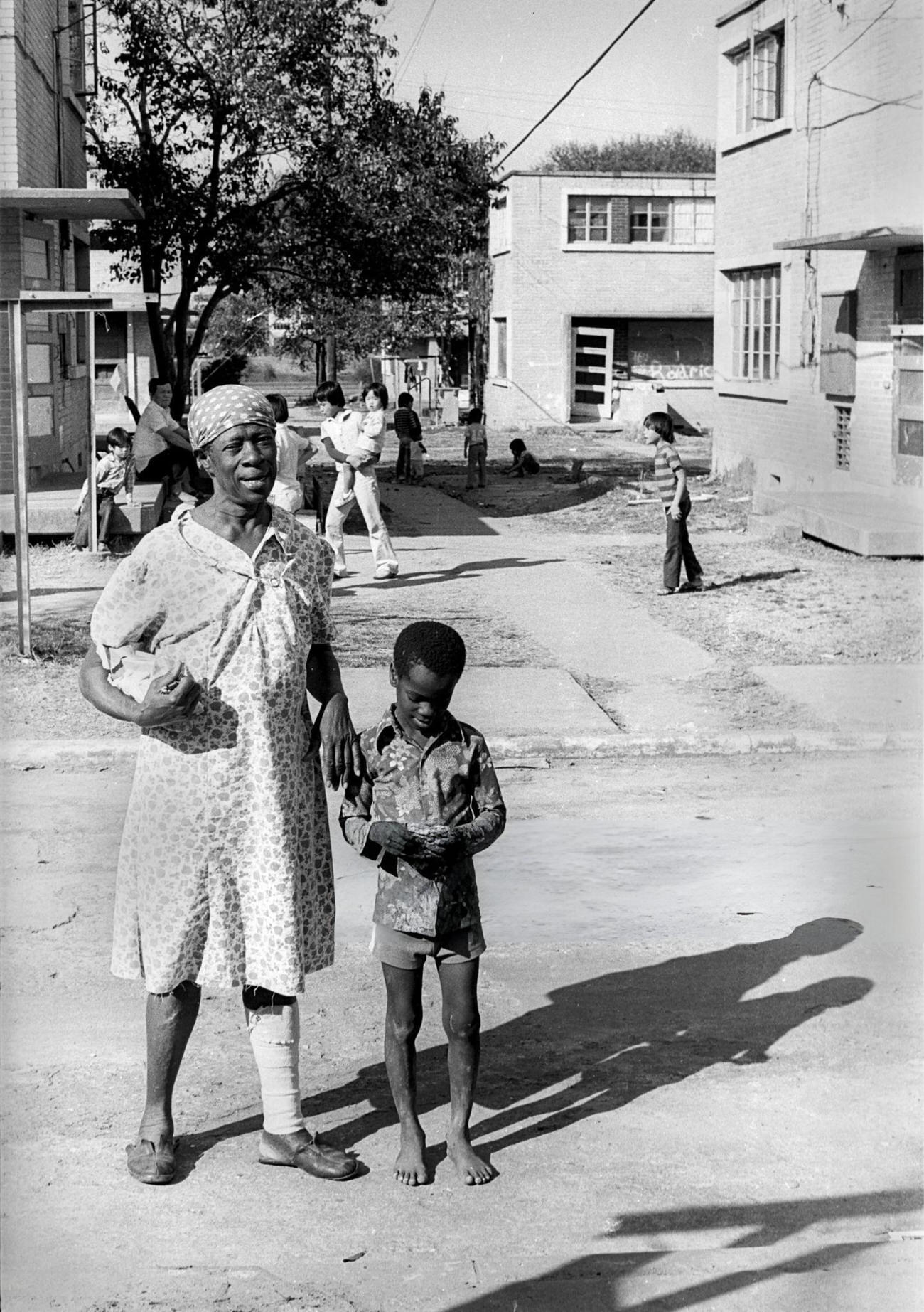#6 A grandmother and her grandson crossing a street, Houston, Texas, 1983.