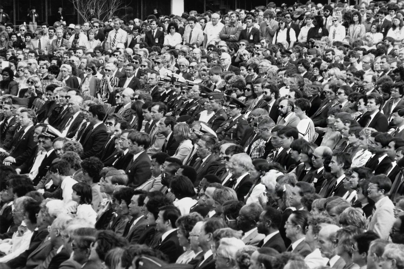 #14 Mourners attend the memorial service for the Space Shuttle Challenger crew at Johnson Space Center, Houston, Texas, 1986.