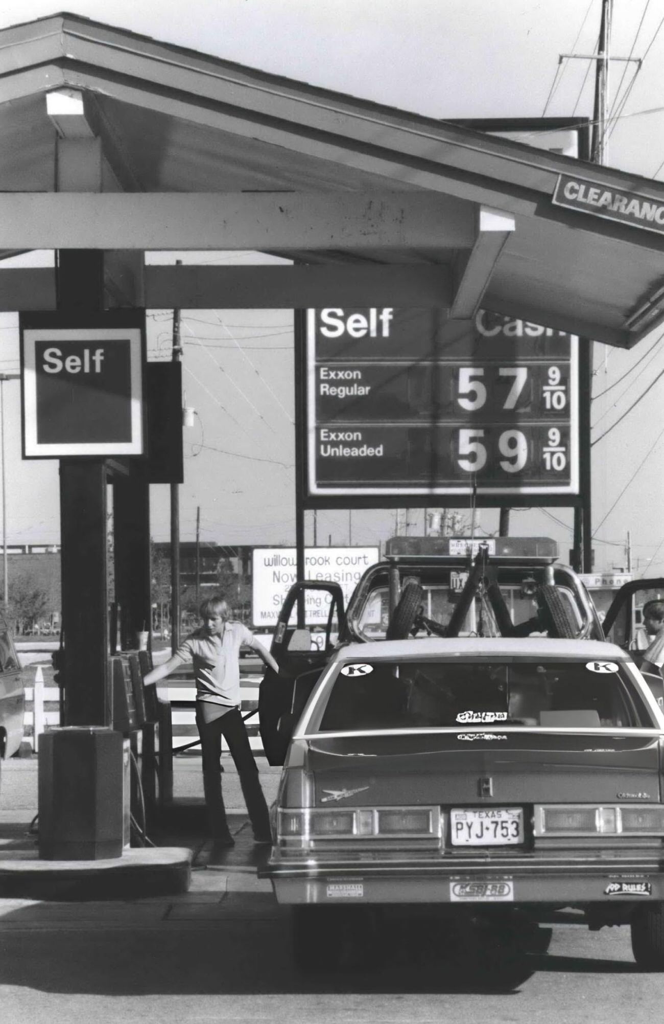 #15 Low gasoline prices at an Exxon station at Hwy 149 and 1960, Houston, Texas, 1980s