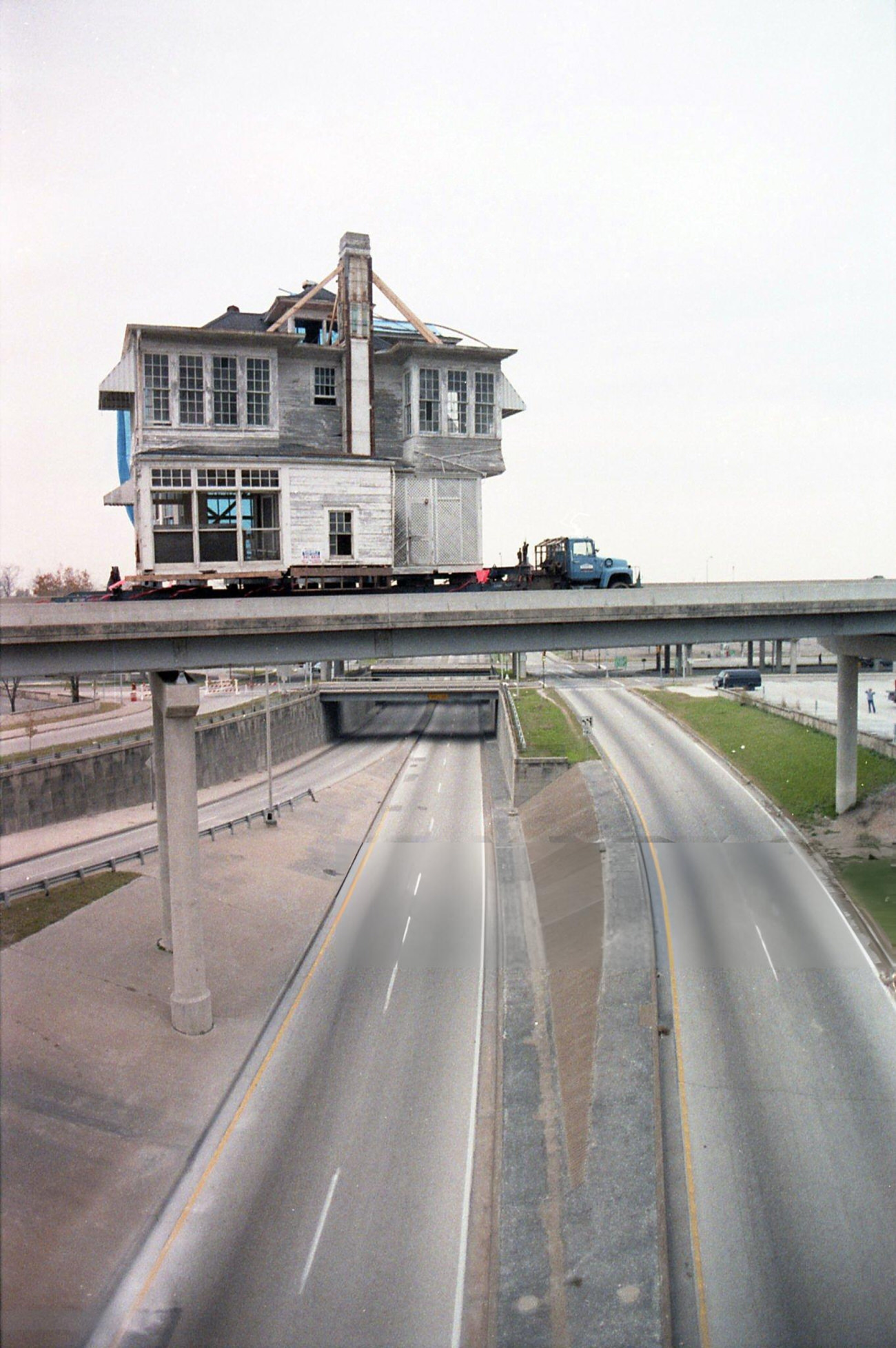 #17 Crews move two sections of a home from Westmoreland Street in Montrose to Sam Houston Park, Houston, Texas, December 14, 1986.