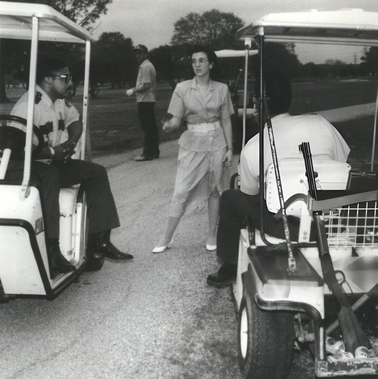 #82 Jon Fontenot attempts to dissuade animal control officers from shooting a coyote at the border of the Sharpstown Park Golf Course, Houston, Texas.