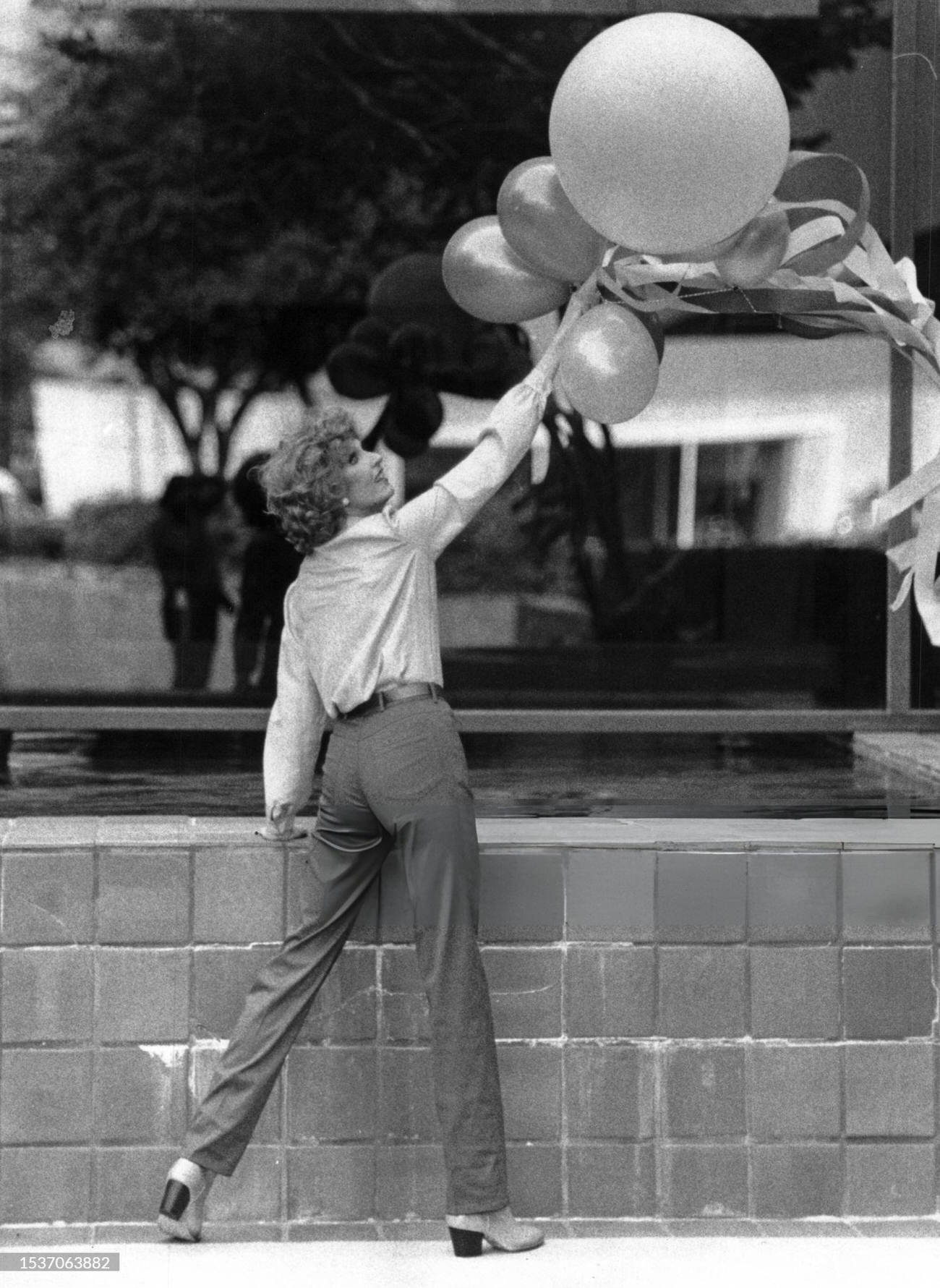 #92 Houston model Dallas Hill models designer Charlotte Ford’s burgundy jeans and top from Saks Fifth Avenue, 1981.