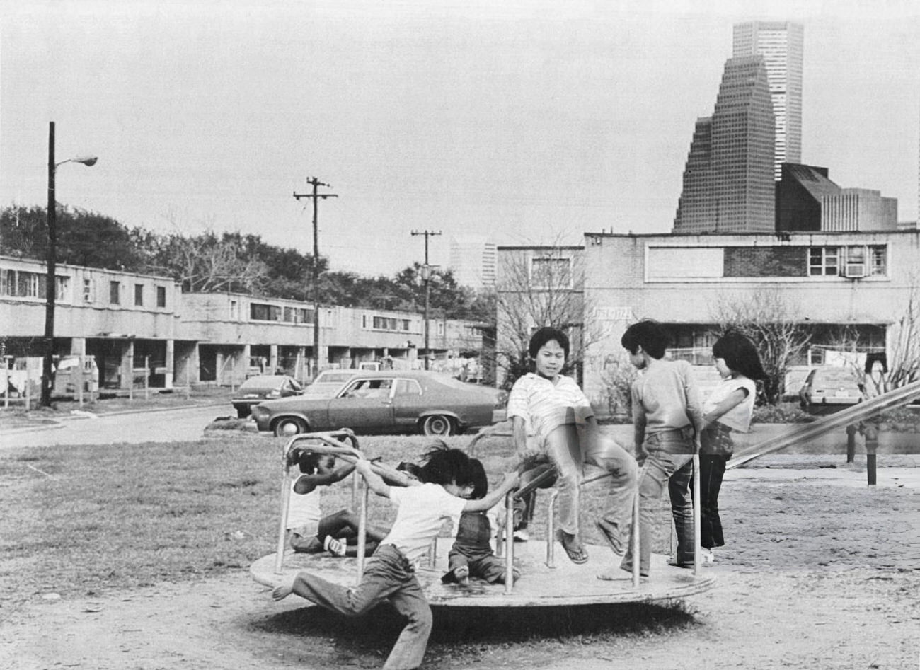 #99 Vietnamese children play at the Allen Harway apartments on the edge of downtown Houston, Texas, March 18, 1985.