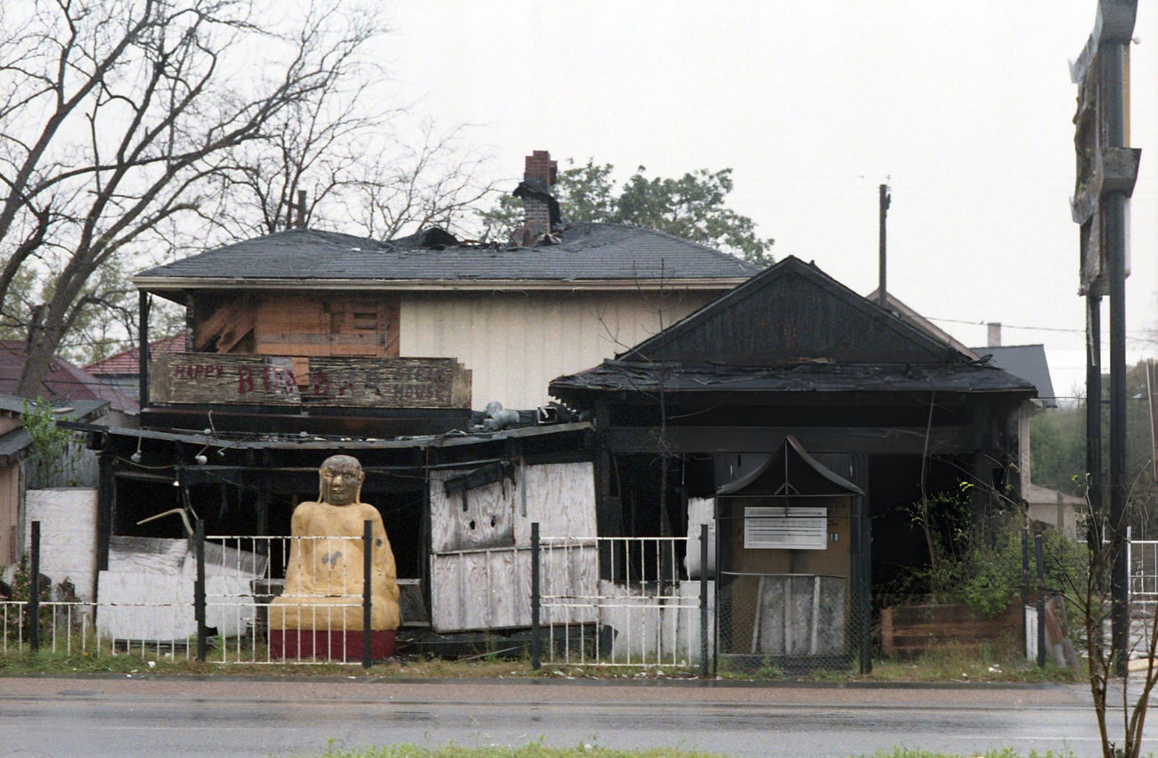 #100 The Happy Buddha restaurant at 516 Westheimer, site of frequent fires, set for demolition, Houston, Texas, March 16, 1987.
