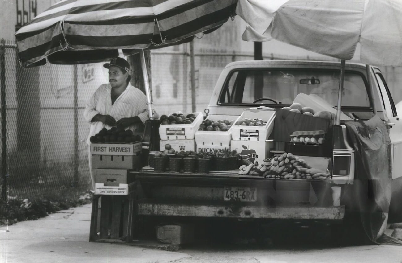#103 Victor Villejas, 23, from Tampico, Mexico, exemplifies entrepreneurial spirit by selling fruit on Harrisburg, enriching Houston’s neighborhood diversity.