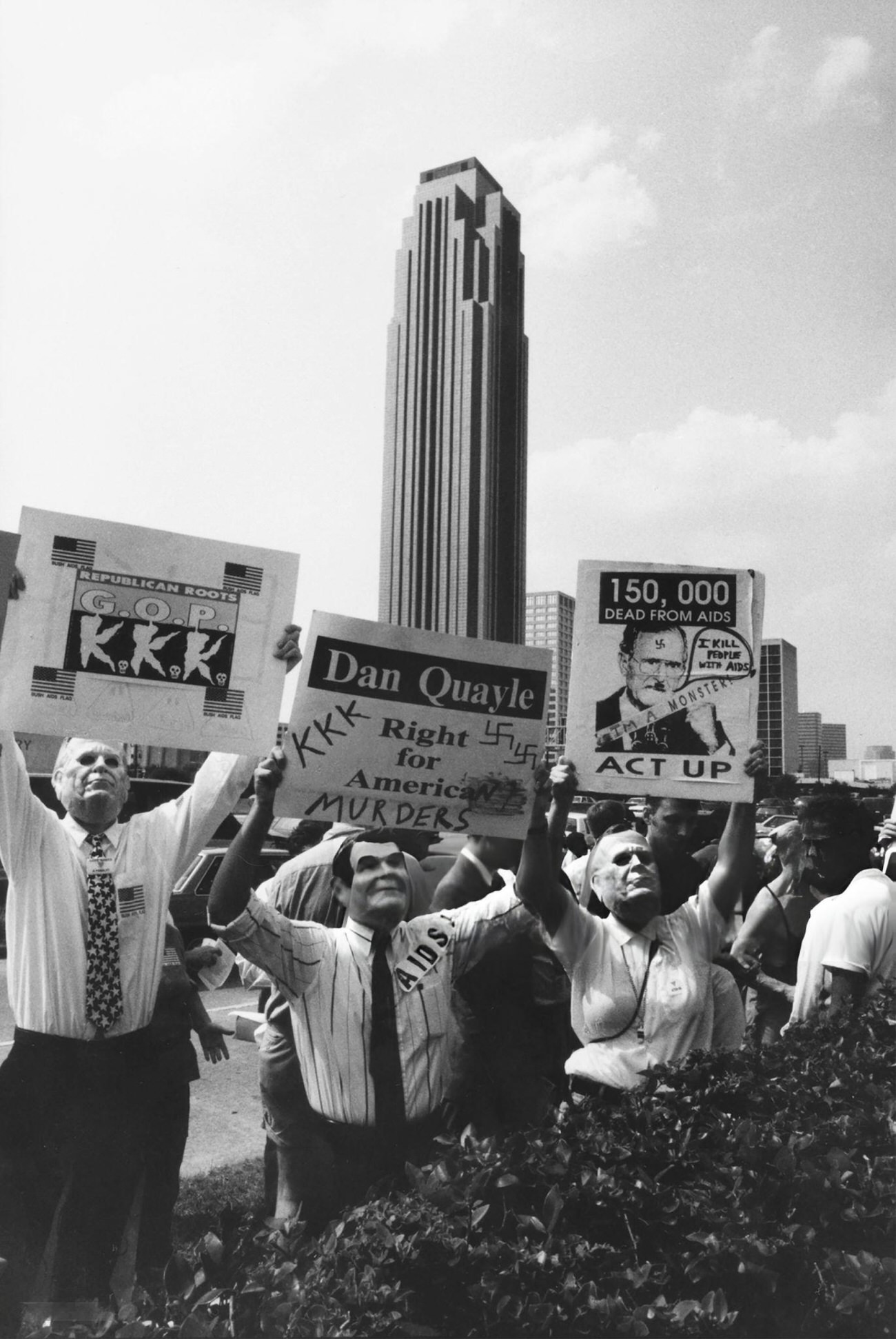 #48 ACT UP activists’ protest on August 20, 1992, wearing Ronald Reagan and George H.W. Bush masks, criticizes government inaction on AIDS and conservative policies, showcasing the era’s political and health activism, Houston, Texas.
