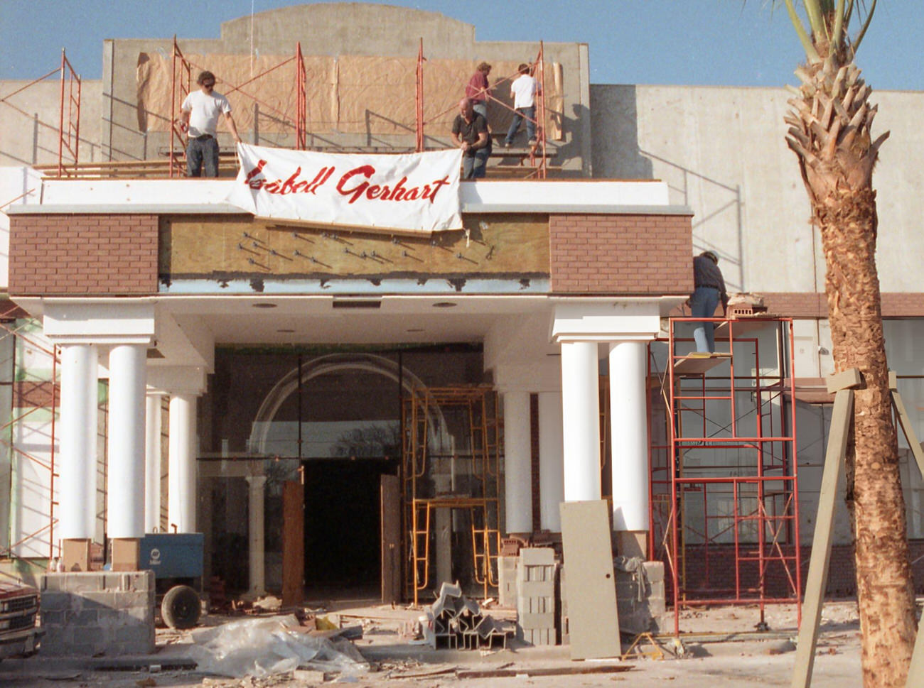#38 Workers install a banner at the Isabell Gerhart store in River Oaks Plaza, marking the upscale clothier’s relocation from the Galleria, Houston, Texas, 1991.