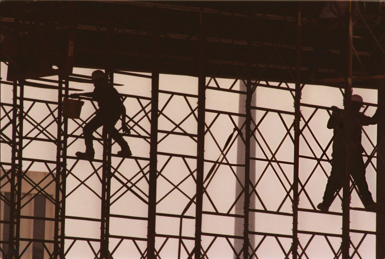 #65 Construction workers perform maintenance on Beltway 8 at I-45, Houston, Texas, 1999.