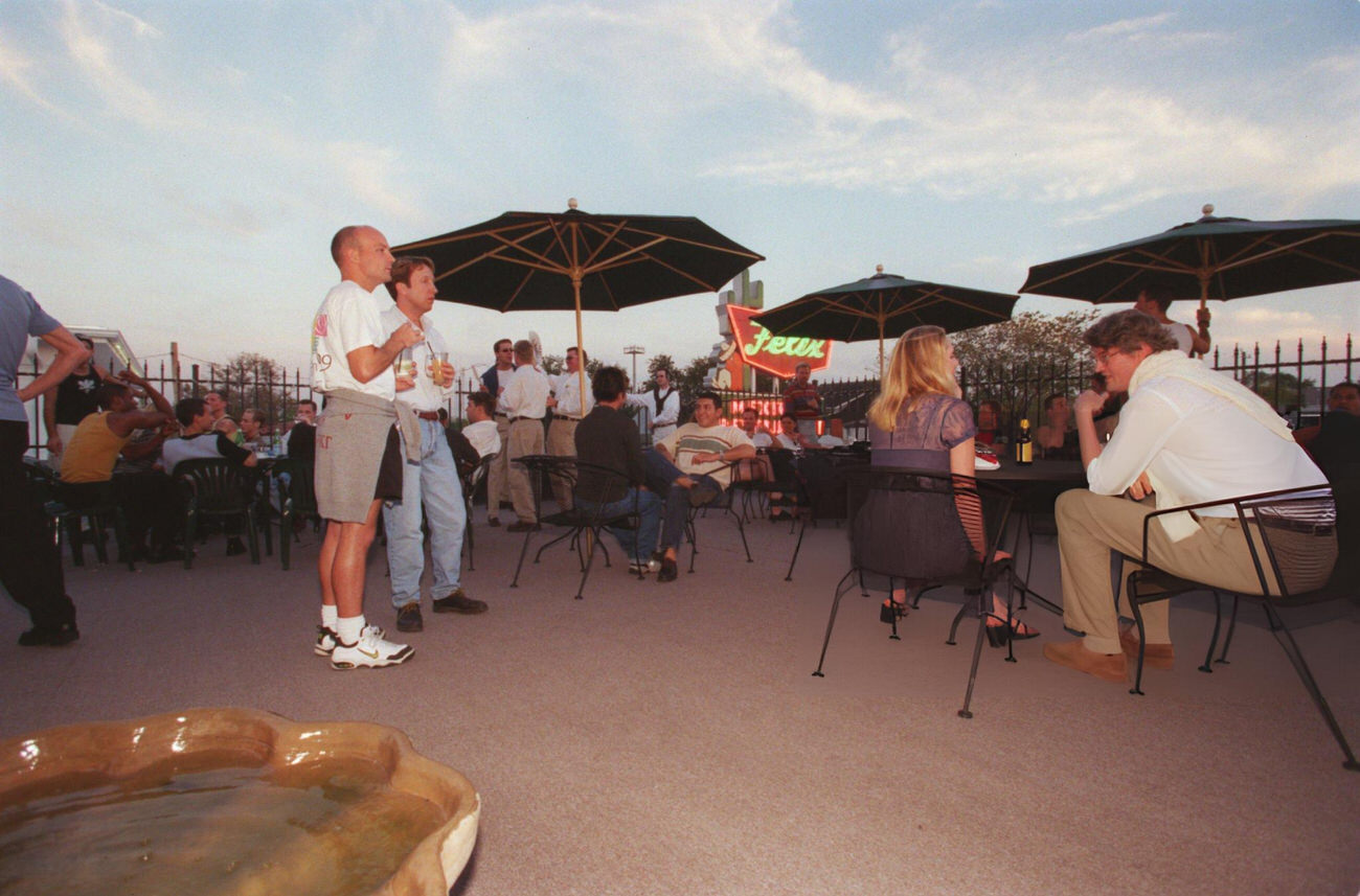 #70 Houstonians enjoy fall weather at Prive Club with a rooftop overlooking Westheimer and Montrose, Houston, Texas, 1999.