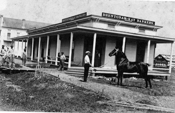 #36 Brenton & McKay Bankers building with men and a horse, 1940s
