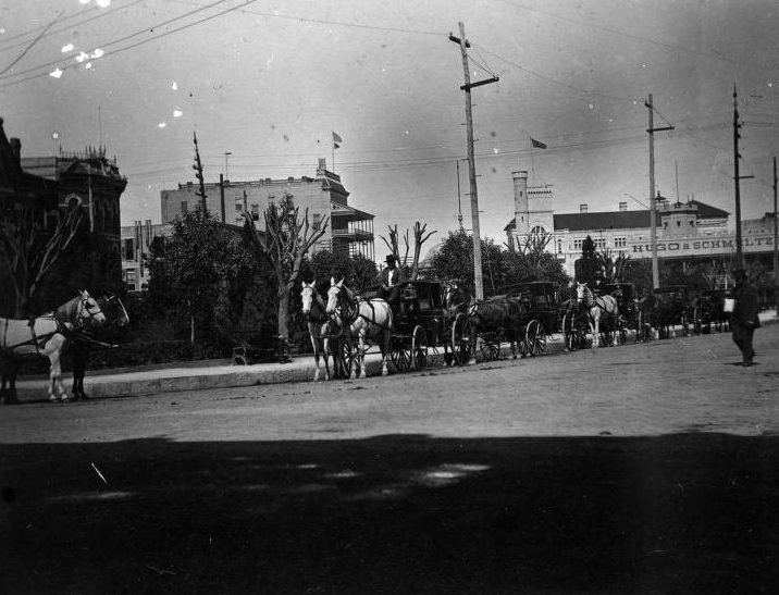 #33 View of Alamo Plaza with carriages, 1896.