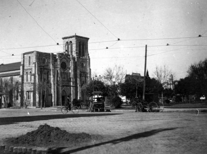 #38 Old Cathedral with carriages and bicycle, 1897