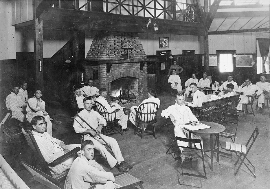 #117 Group gathered around a fireplace in the convalescent building at Camp Logan, Houston, Texas, 1920