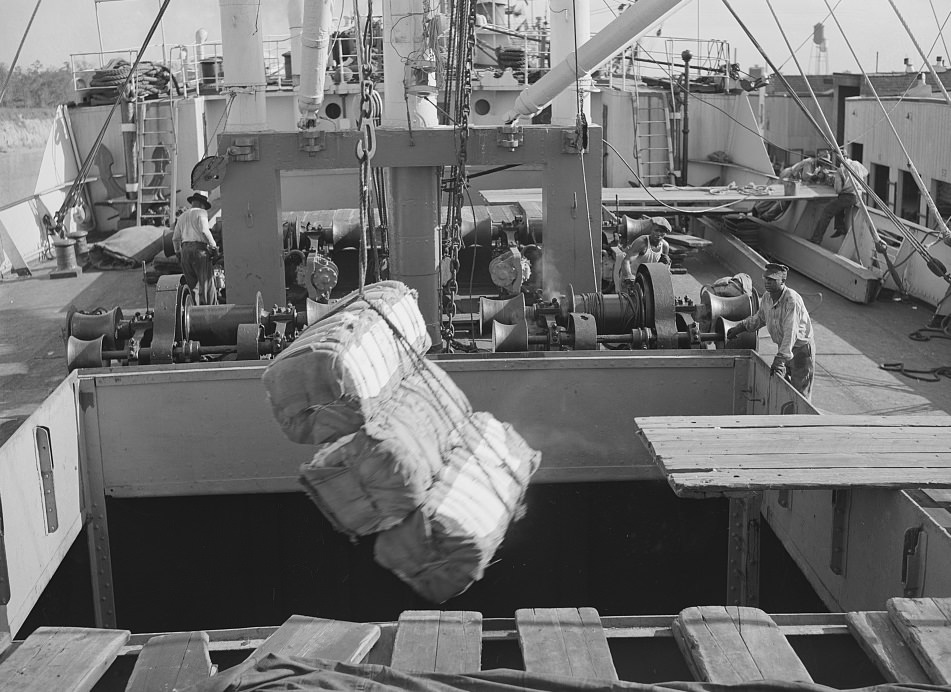 #60 Loading cotton into a ship’s hold at the Port of Houston, Texas, 1939