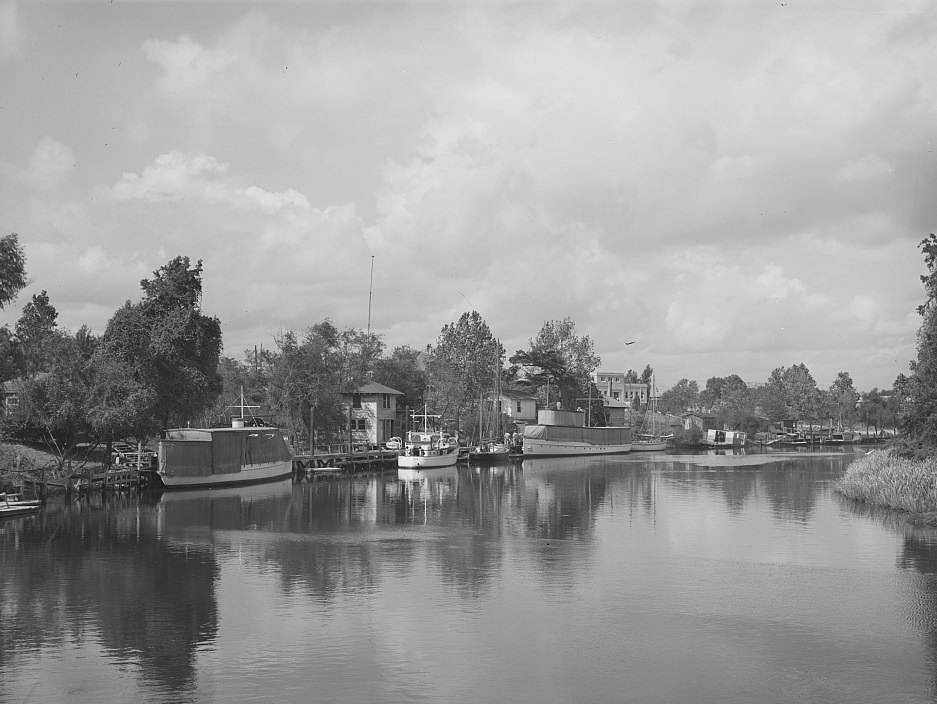 #69 Former main ship channel at the Port of Houston, Texas, converted into a yacht pen, 1939